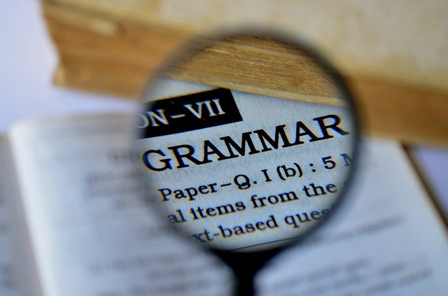 loupe on the word “grammar.”