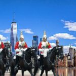 Men in traditional UK clothing riding horses, representing Linguapress